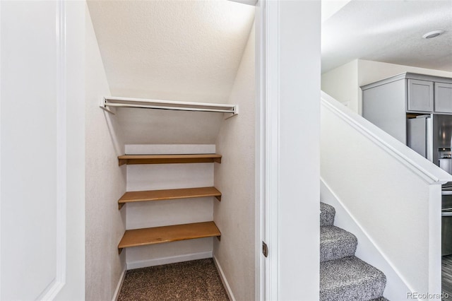 21761 E 7th Ave, Aurora, CO 80018 - stairway with baseboards and carpet flooring
