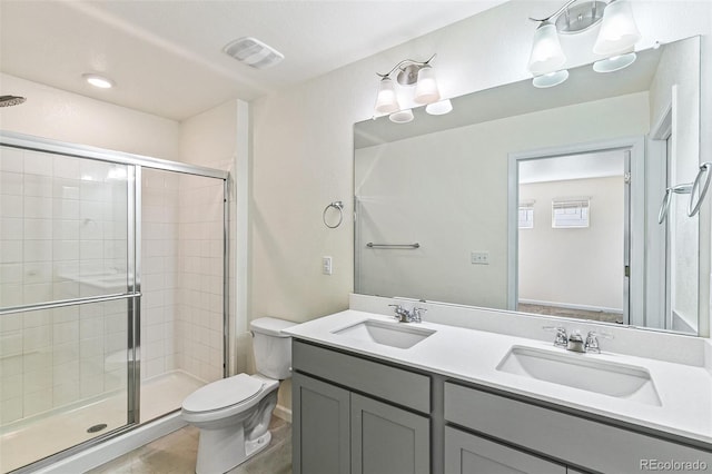21761 E 7th Ave, Aurora, CO 80018 - full bathroom featuring a stall shower, toilet, double vanity, and tile patterned flooring