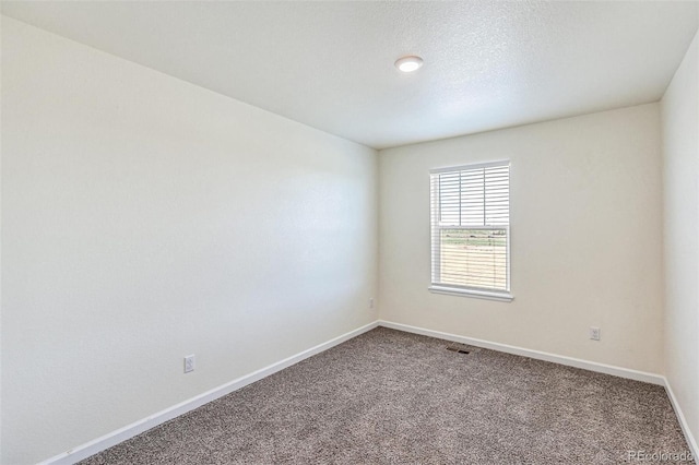 21761 E 7th Ave, Aurora, CO 80018 - spare room featuring carpet floors and baseboards