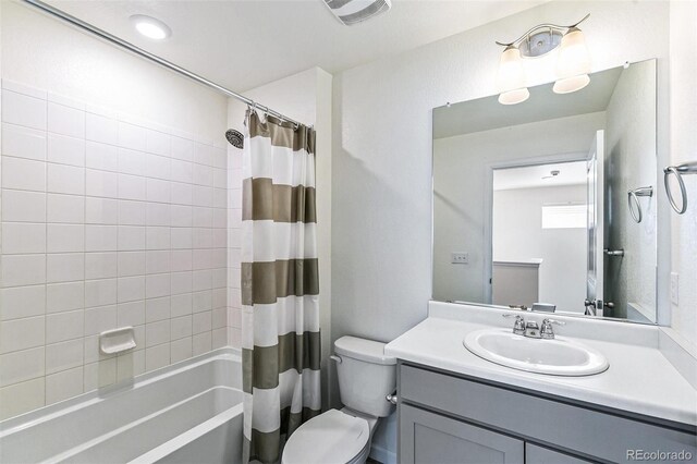 21761 E 7th Ave, Aurora, CO 80018 - bathroom with toilet, vanity, and shower / bath combo
