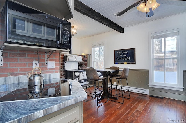 129 Lang St, Twin Lakes, CO 81251 - kitchen with black appliances, dark wood finished floors, white cabinetry, ceiling fan, and a wooden ceiling with exposed beams
