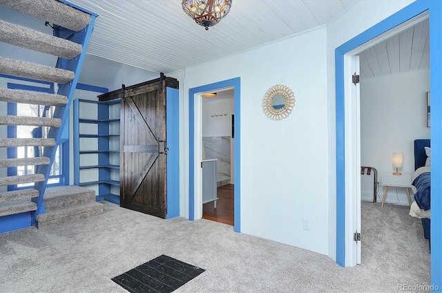 129 Lang St, Twin Lakes, CO 81251 - unfurnished bedroom with carpet, a barn door, and wood ceiling