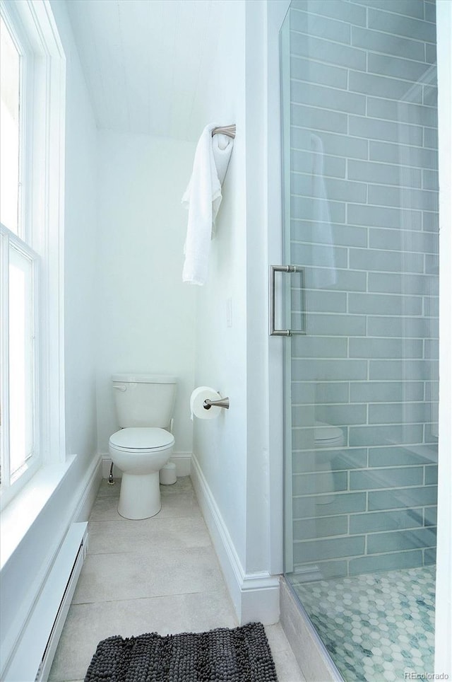 129 Lang St, Twin Lakes, CO 81251 - bathroom with a baseboard heating unit, a stall shower, and tile patterned flooring