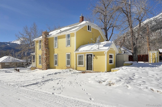 129 Lang St, Twin Lakes, CO 81251 - snow covered house featuring a chimney