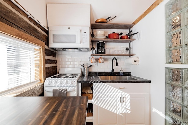 129 Lang St, Twin Lakes, CO 81251 - kitchen featuring white appliances, decorative backsplash, dark countertops, white cabinetry, and glass insert cabinets