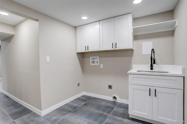 laundry room with cabinets, sink, electric dryer hookup, and hookup for a washing machine