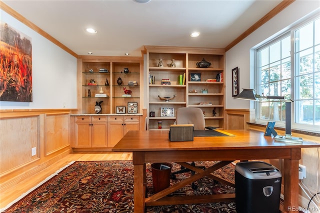 office space featuring recessed lighting, light wood-type flooring, a wainscoted wall, and ornamental molding