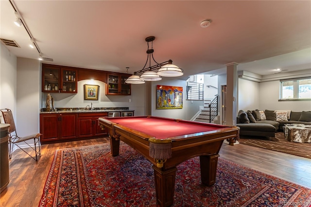 playroom featuring dark wood finished floors, track lighting, visible vents, pool table, and indoor wet bar