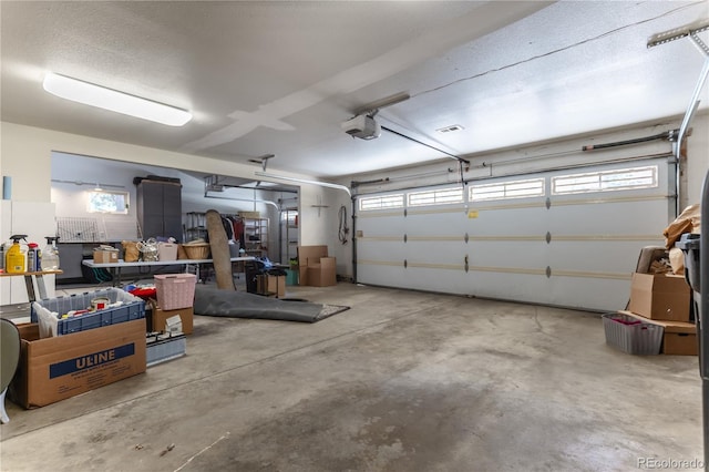 garage featuring a garage door opener