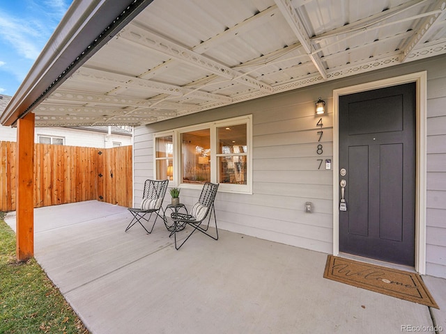 view of patio featuring fence