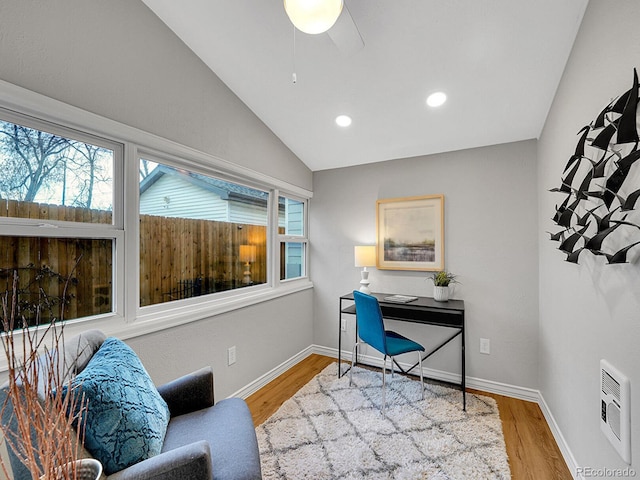 home office with vaulted ceiling, recessed lighting, wood finished floors, and baseboards