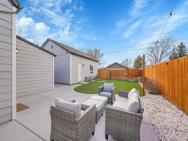 view of patio / terrace featuring a fenced backyard, outdoor lounge area, and an outdoor structure