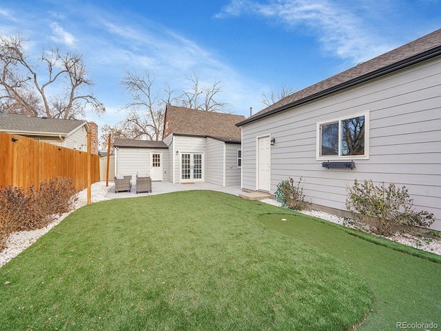 rear view of house featuring a lawn, a patio area, fence, and an outdoor living space