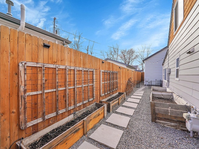 view of yard featuring a garden and fence