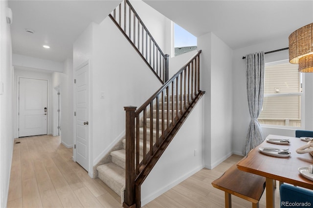 13446 Amber Sky St, Parker, CO 80134 - stairs featuring wood finished floors, baseboards, and recessed lighting