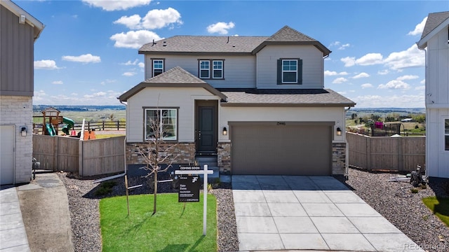 13446 Amber Sky St, Parker, CO 80134 - view of front facade featuring an attached garage, fence, a shingled roof, driveway, and stone siding