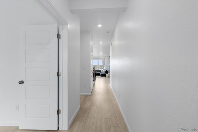 13446 Amber Sky St, Parker, CO 80134 - hall featuring light wood-style floors, baseboards, and recessed lighting