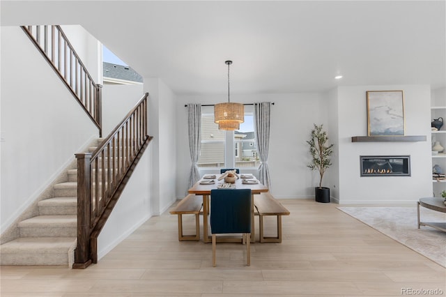 13446 Amber Sky St, Parker, CO 80134 - dining space featuring stairs, light wood-type flooring, healthy amount of natural light, and recessed lighting
