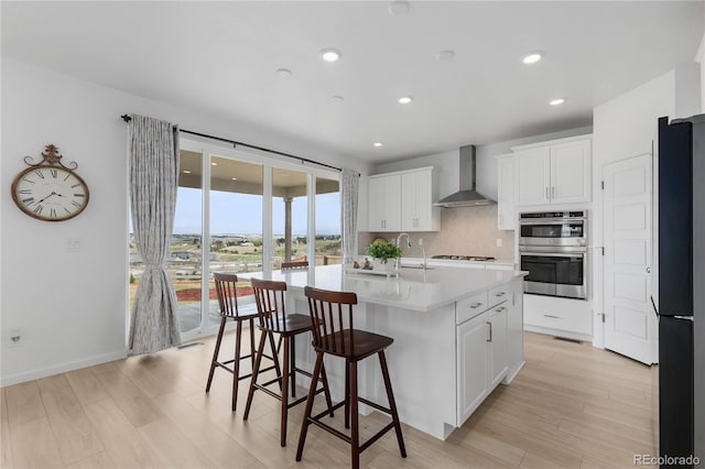 13446 Amber Sky St, Parker, CO 80134 - kitchen featuring wall chimney exhaust hood, freestanding refrigerator, double oven, light countertops, and white cabinetry