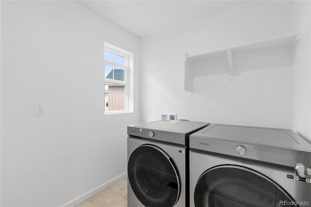 13446 Amber Sky St, Parker, CO 80134 - laundry room featuring washing machine and dryer, baseboards, and light tile patterned flooring
