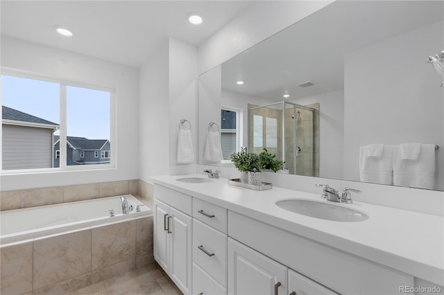 13446 Amber Sky St, Parker, CO 80134 - bathroom featuring a stall shower, a garden tub, double vanity, recessed lighting, and tile patterned floors