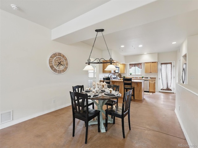 dining area with baseboards, concrete flooring, and recessed lighting