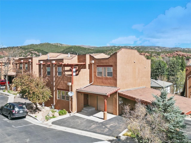 view of building exterior with a mountain view