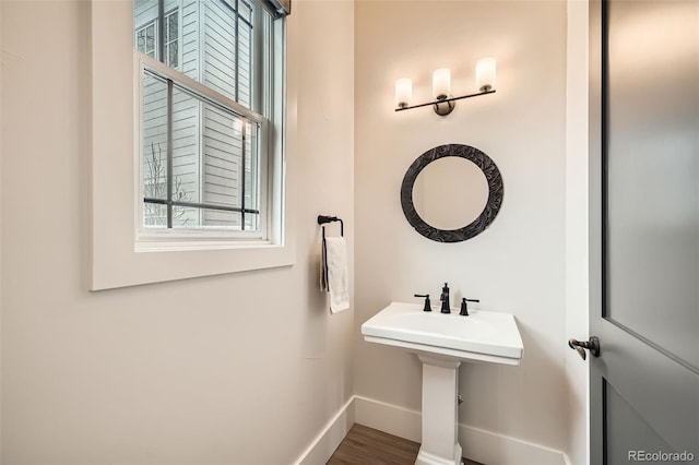 bathroom featuring baseboards and wood finished floors