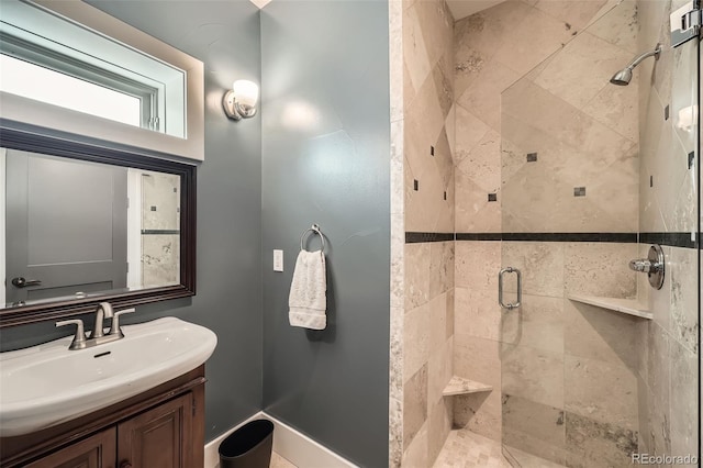 full bathroom featuring a stall shower and vanity