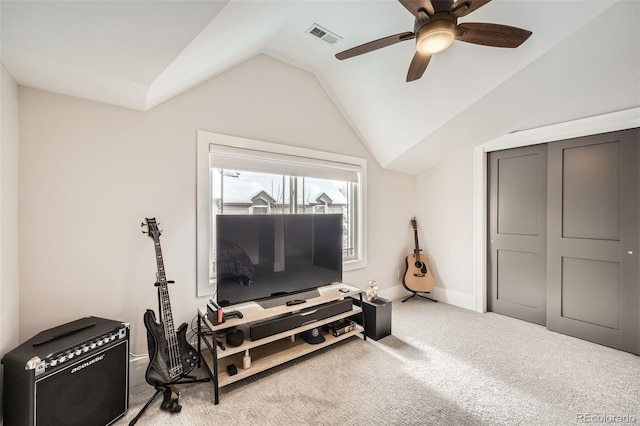 workout room with lofted ceiling, visible vents, baseboards, a ceiling fan, and carpet