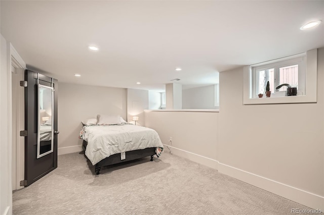 bedroom with light carpet, baseboards, and recessed lighting