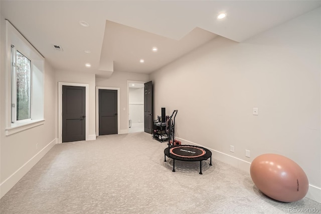 interior space with carpet floors, baseboards, visible vents, and recessed lighting