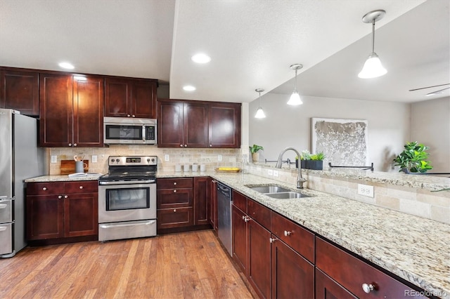 1095 W 69th Ave, Denver, CO 80221 - kitchen featuring stainless steel appliances, dark brown cabinets, tasteful backsplash, and recessed lighting