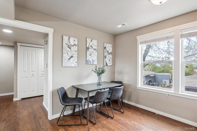 1095 W 69th Ave, Denver, CO 80221 - dining space with baseboards and wood finished floors