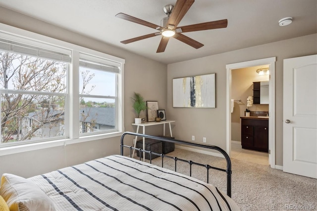 1095 W 69th Ave, Denver, CO 80221 - bedroom with light colored carpet, a ceiling fan, and ensuite bathroom