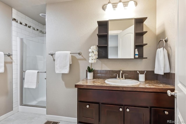 1095 W 69th Ave, Denver, CO 80221 - bathroom featuring vanity, a stall shower, and tile patterned floors