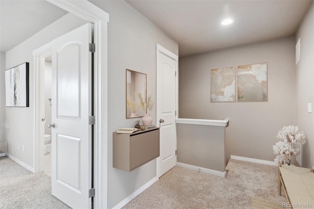 1095 W 69th Ave, Denver, CO 80221 - corridor featuring carpet flooring and an upstairs landing