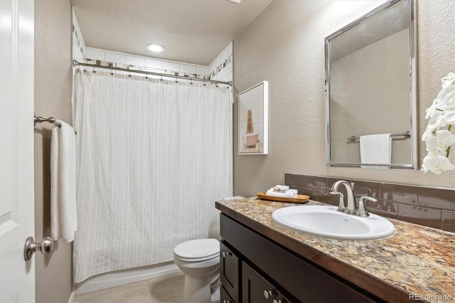 1095 W 69th Ave, Denver, CO 80221 - full bath featuring vanity, a textured wall, and tile patterned floors