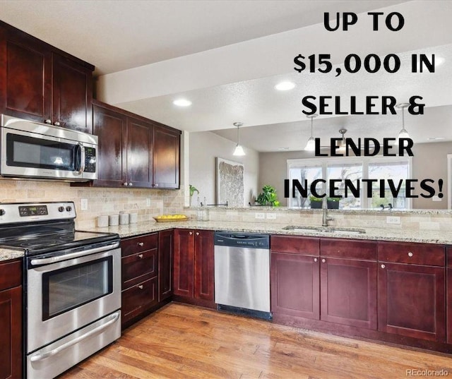 1095 W 69th Ave, Denver, CO 80221 - kitchen with appliances with stainless steel finishes, dark brown cabinets, light wood-type flooring, and decorative backsplash