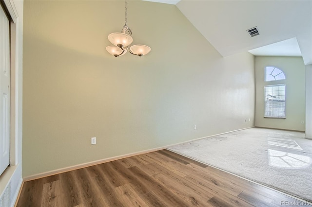 unfurnished room featuring hardwood / wood-style flooring and high vaulted ceiling