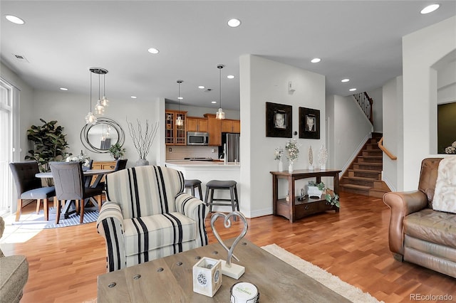 10152 Bluffmont Ln, Lone Tree, CO 80124 - living room featuring light wood-type flooring, recessed lighting, and stairway