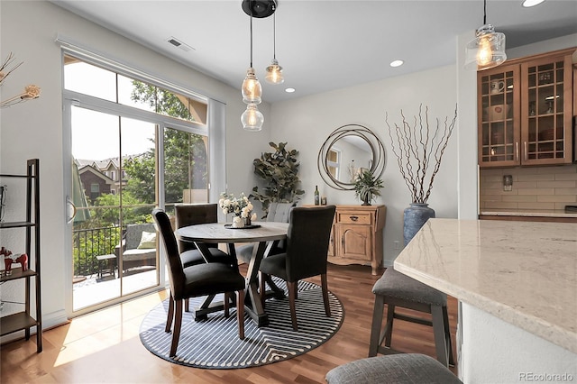 10152 Bluffmont Ln, Lone Tree, CO 80124 - dining space featuring dark wood-style flooring and recessed lighting
