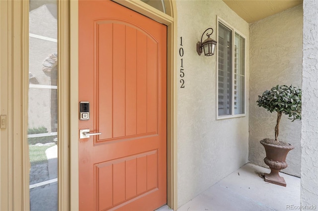 10152 Bluffmont Ln, Lone Tree, CO 80124 - property entrance featuring stucco siding