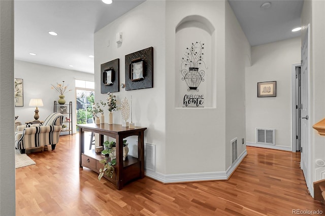 10152 Bluffmont Ln, Lone Tree, CO 80124 - hallway featuring light wood-style flooring and recessed lighting
