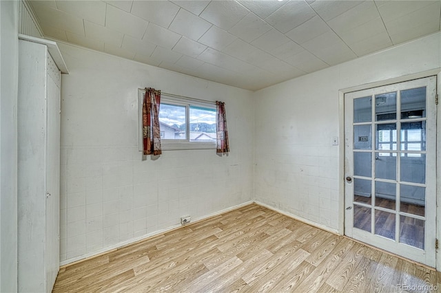 spare room with light hardwood / wood-style floors