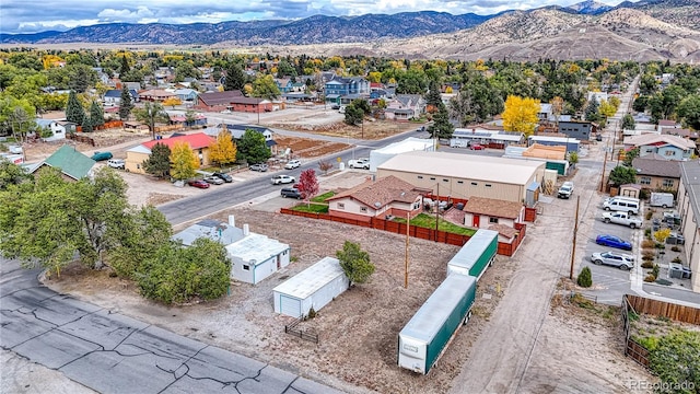 birds eye view of property featuring a mountain view