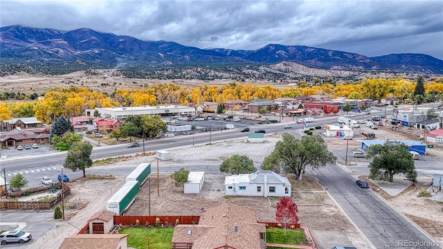 birds eye view of property with a mountain view