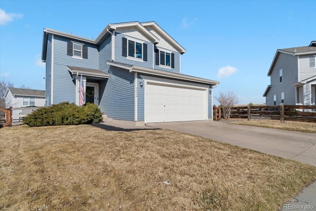 view of front of home with a garage, concrete driveway, a front yard, and fence