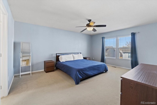 bedroom featuring ceiling fan, carpet flooring, and baseboards