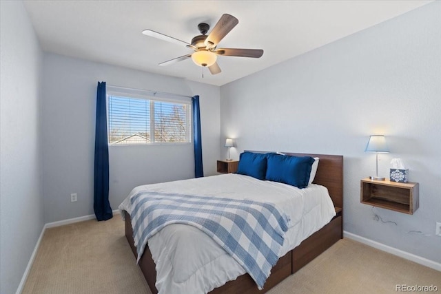 carpeted bedroom featuring ceiling fan and baseboards